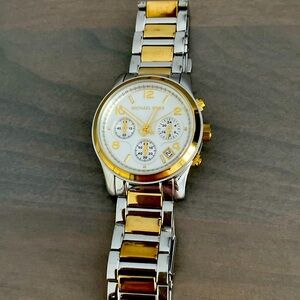 Ladies Michael Kors two-tone watch.